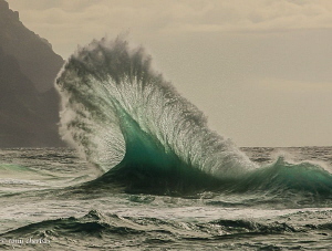 Waves collide on the Napali Coast. Kauai, Hawaii by Tony Cherbas 